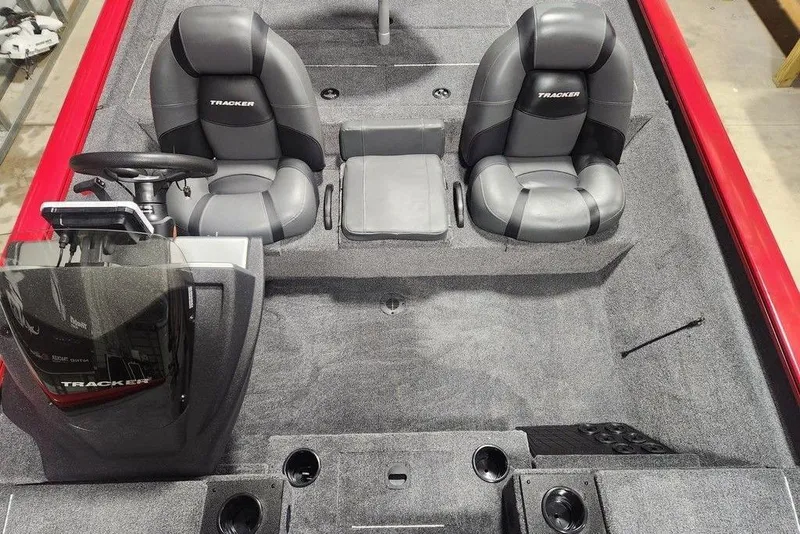 Slide: The Image of 2026 Tracker Pro Team 195 boat interior with dual seats and steering console. - 10