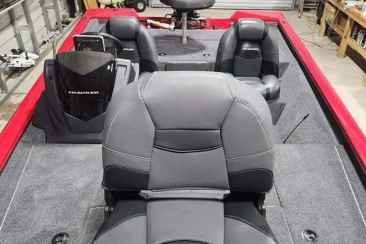 Slide: The Image of 2026 Tracker Pro Team 195 boat interior with gray and black seating, red accents. - 11
