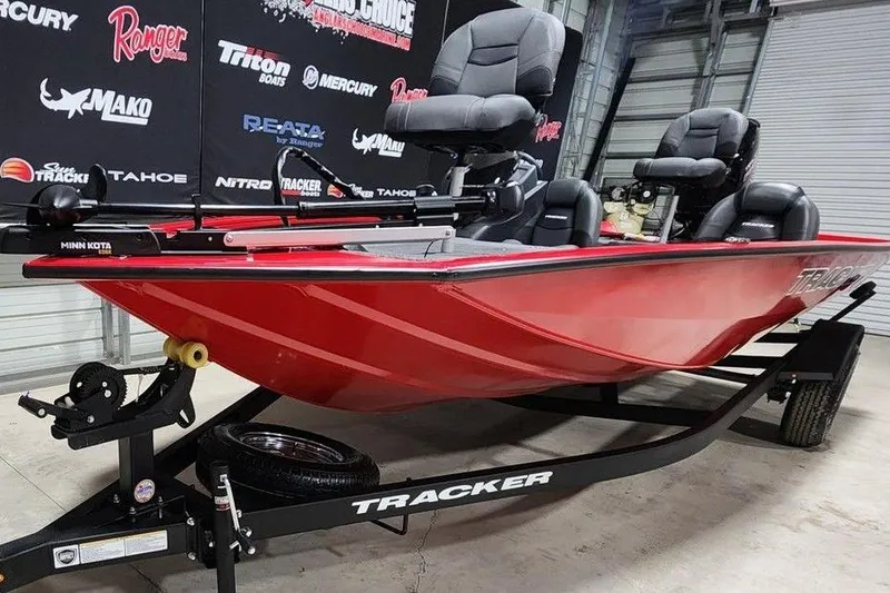 Slide: The Image of 2026 Tracker Pro Team 195 boat in showroom, red hull, on trailer. - 4