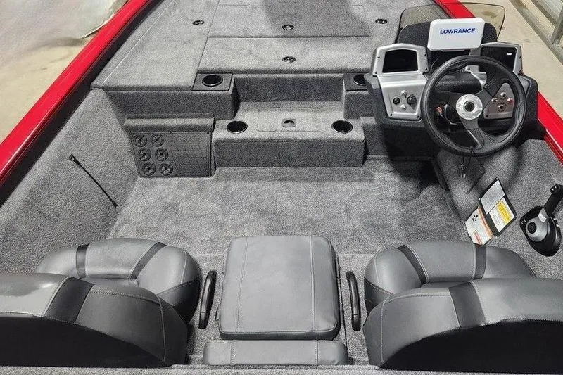 Slide: The Image of 2026 Tracker Pro Team 195 boat interior with steering wheel and seating. - 5