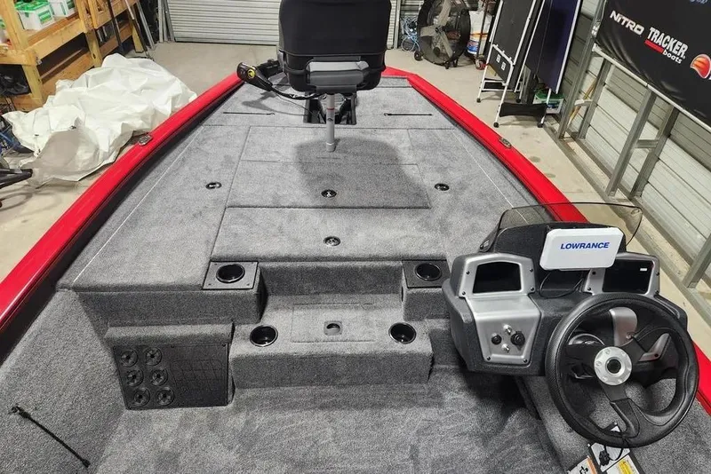 Slide: The Image of 2026 Tracker Pro Team 195 boat interior with steering console and Lowrance electronics. - 8