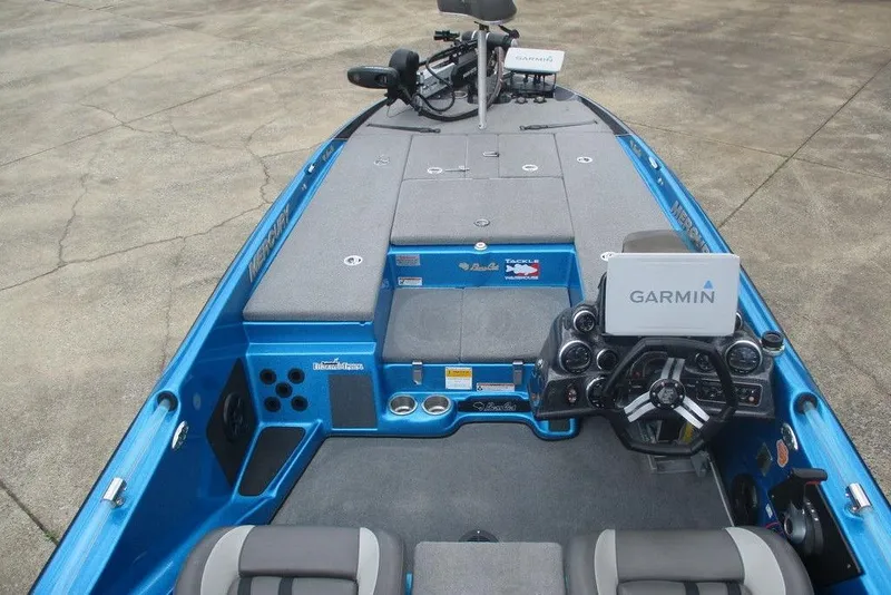 Slide: The Image of 2020 Bass Cat Puma FTD boat interior with Garmin navigation system, blue and gray design. - 3