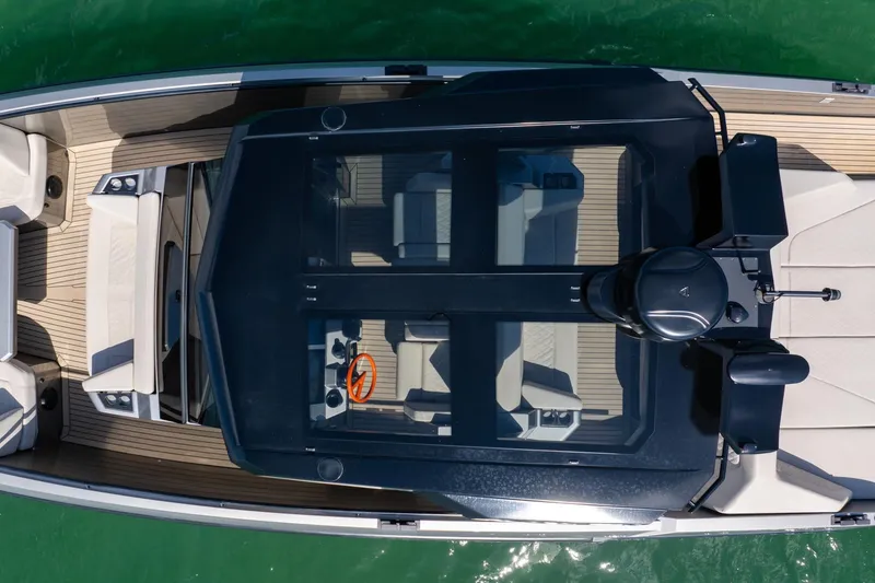 Slide: The Image of Overhead view of 2022 Vanquish VQ40 luxury boat on water. - 14