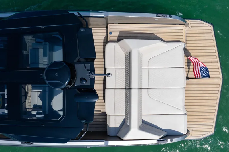 Slide: The Image of Top view of 2022 Vanquish VQ40 yacht with American flag on deck. - 15