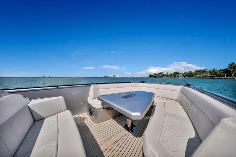 Slide: The Image of Luxurious 2022 Vanquish VQ40 yacht with elegant seating and scenic ocean view. - 20