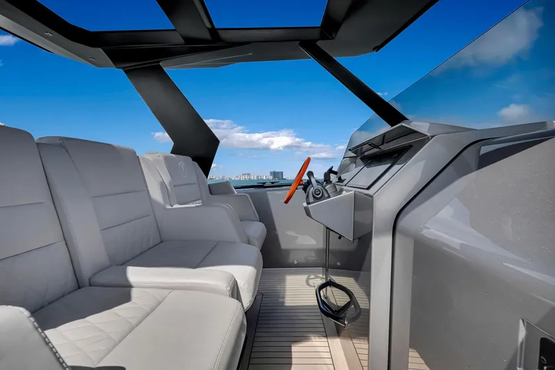 Slide: The Image of Luxurious interior of 2022 Vanquish VQ40 yacht with modern seating and steering. - 27