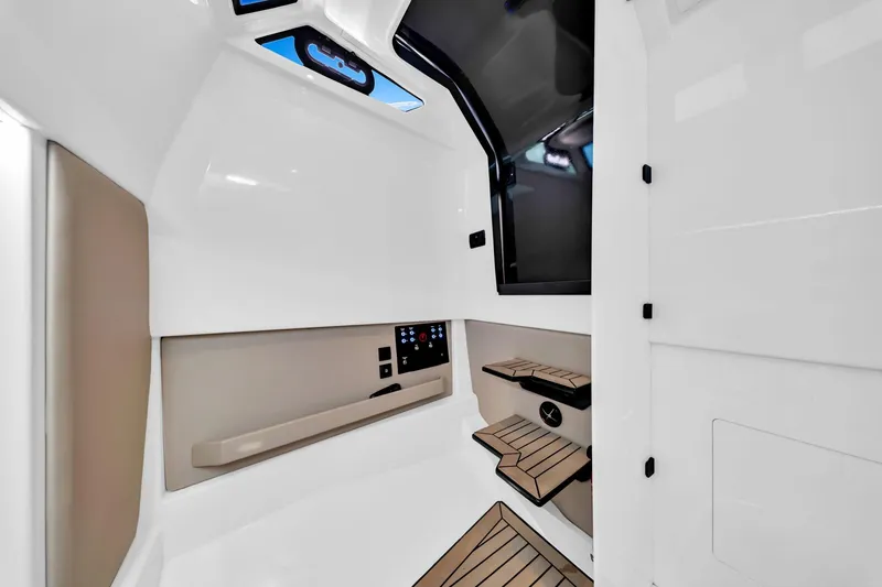 Slide: The Image of Interior of 2022 Vanquish VQ40 yacht, featuring sleek design and modern controls. - 30