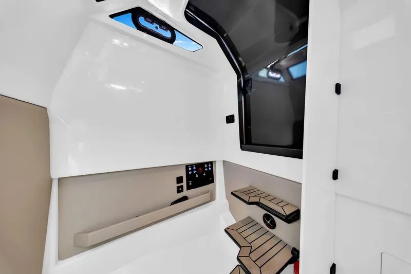 Slide: The Image of Interior of 2022 Vanquish VQ40 yacht, featuring sleek design and modern controls. - 31