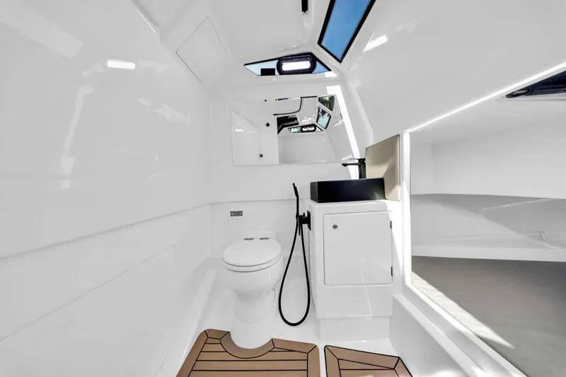 Slide: The Image of 2022 Vanquish VQ40 yacht interior with modern bathroom and sleek design. - 33