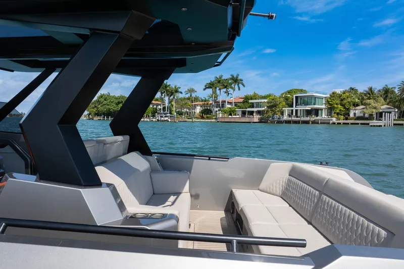 Slide: The Image of 2022 Vanquish VQ40 luxury yacht interior with waterfront view, modern seating, and sleek design. - 40