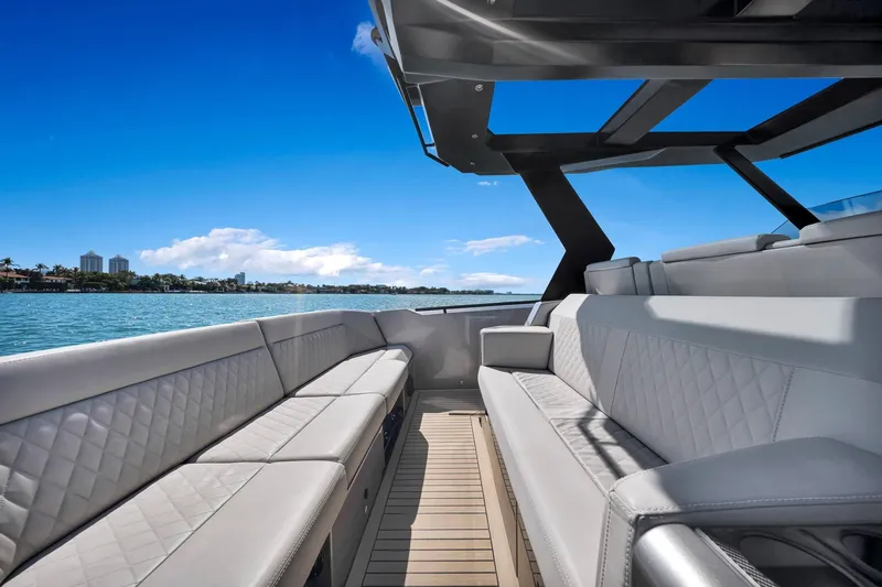 Slide: The Image of Luxurious 2022 Vanquish VQ40 yacht interior with elegant seating and scenic ocean view. - 41