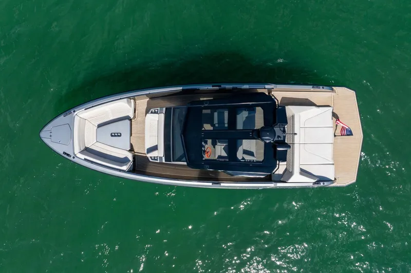 Slide: The Image of Overhead view of 2022 Vanquish VQ40 yacht on green water. - 49