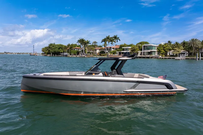 Slide: The Image of 2022 Vanquish VQ40 luxury yacht on a sunny waterfront. - 51