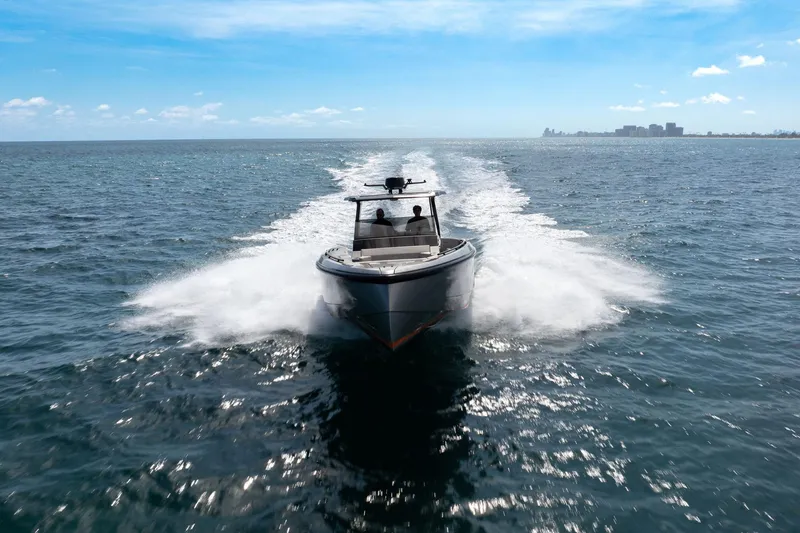Slide: The Image of 2022 Vanquish VQ40 boat cruising on open sea under clear blue sky. - 56