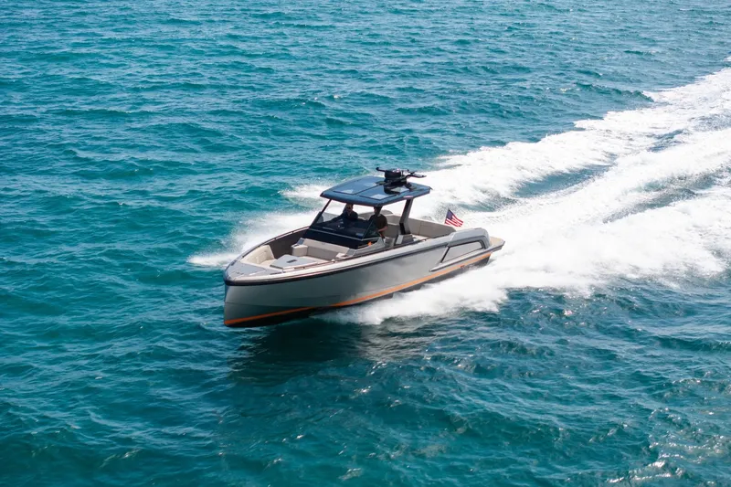 Slide: The Image of 2022 Vanquish VQ40 boat cruising on open blue water. - 58