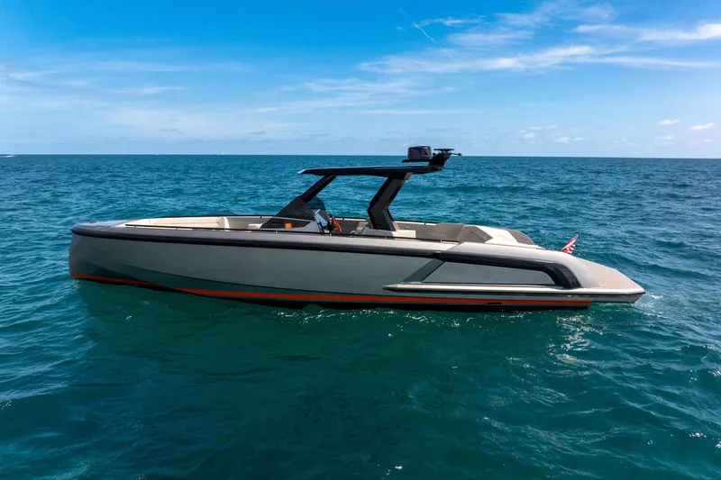 Slide: The Image of 2022 Vanquish VQ40 luxury yacht cruising on open sea under clear blue sky. - 6