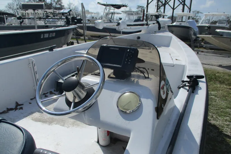 Slide: The Image of 2012 Stumpknocker 17 SPORT boat with steering wheel and navigation equipment. - 4