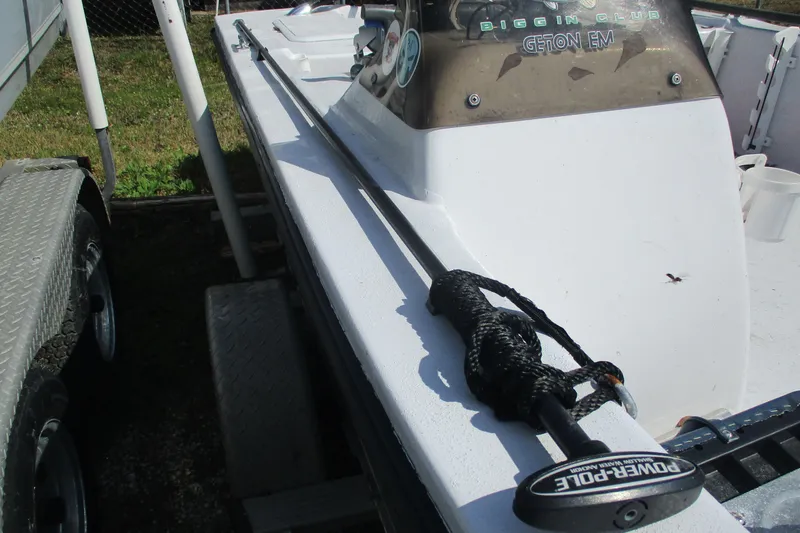Slide: The Image of 2012 Stumpknocker 17 SPORT boat with Power-Pole anchor, parked on a trailer. - 6