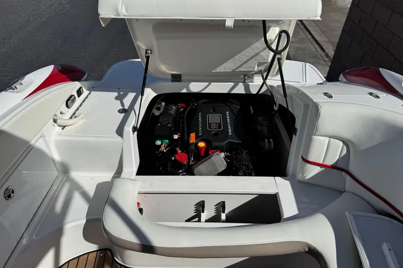 Slide: The Image of Open engine compartment of a 2004 Cobalt 240SD boat, showcasing the Volvo Penta engine. - 26