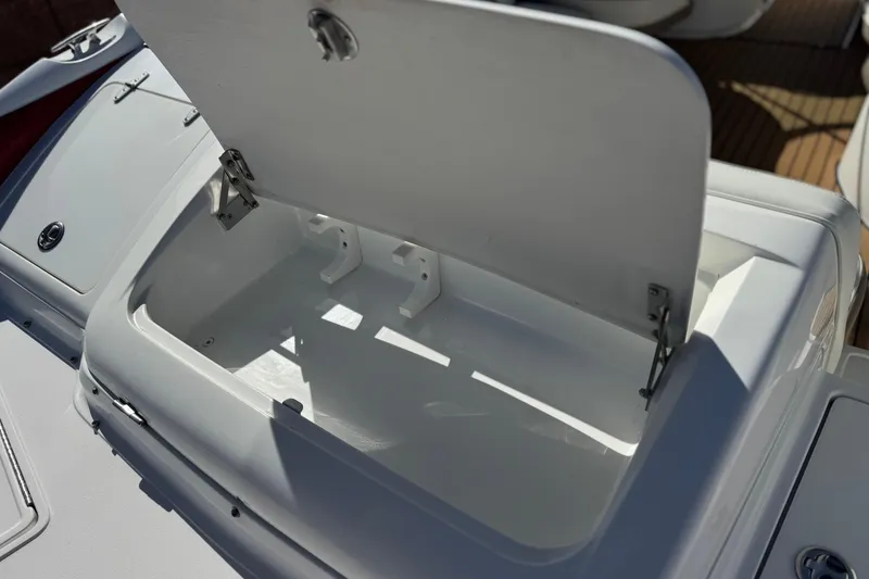 Slide: The Image of Open storage compartment on a 2004 Cobalt 240SD boat, showcasing interior space. - 7