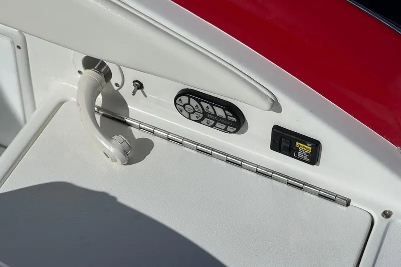 Slide: The Image of Control panel of a 2004 Cobalt 240SD boat with handle and switches. - 8