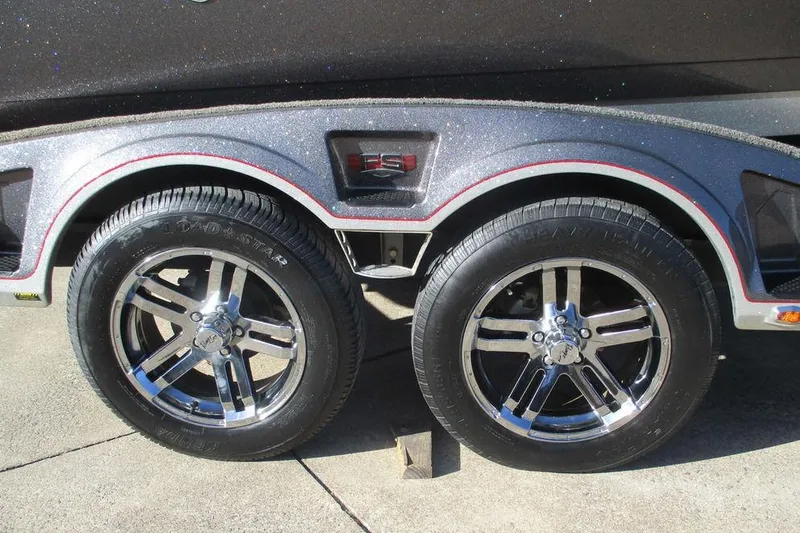 Slide: The Image of 2020 Ranger 620FS Cup-Equipped trailer with shiny chrome wheels on concrete surface. - 12