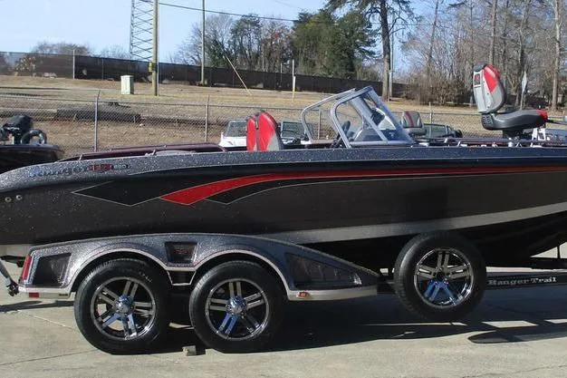 Slide: The Image of 2020 Ranger 620FS Cup-Equipped boat on trailer, sleek design, black and red accents. - 4