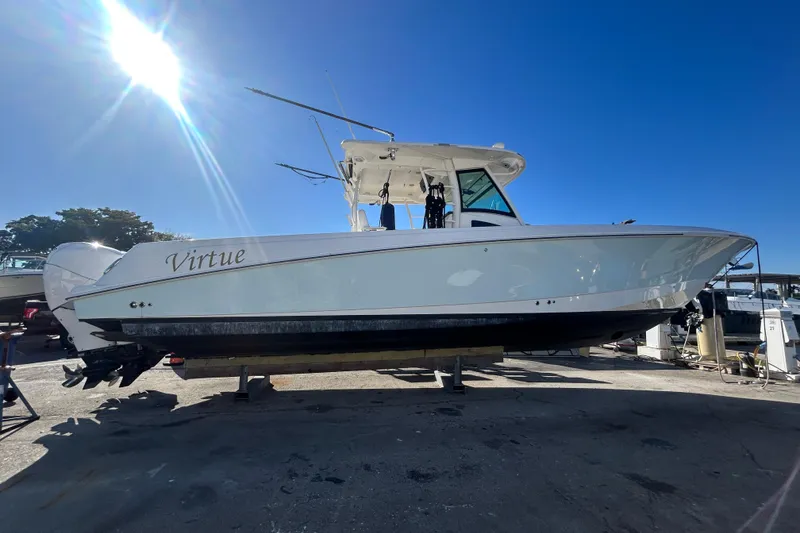 The Image of 2012 Boston Whaler 370 Outrage boat named "Virtue" under bright sunlight. - 0