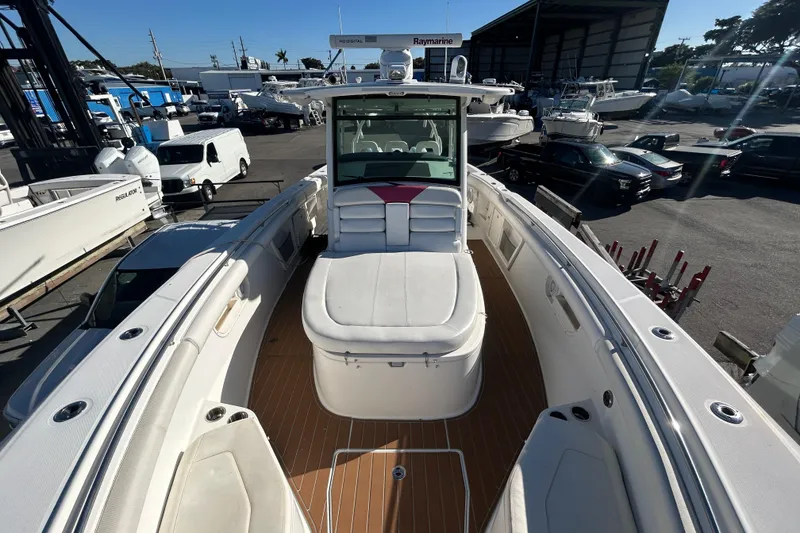 Slide: The Image of 2012 Boston Whaler 370 Outrage boat interior with seating and deck view. - 10