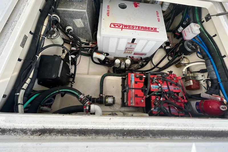 Slide: The Image of Engine compartment of a 2012 Boston Whaler 370 Outrage with Westerbeke generator and batteries. - 16