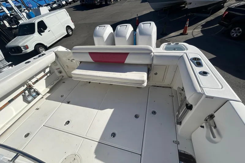 Slide: The Image of 2012 Boston Whaler 370 Outrage boat interior with seating and storage compartments. - 3