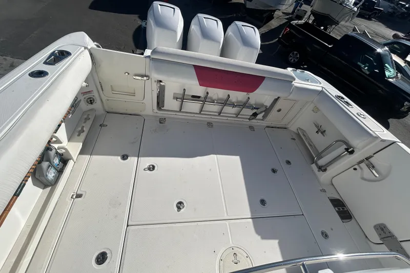 Slide: The Image of 2012 Boston Whaler 370 Outrage boat deck with storage and seating. - 4