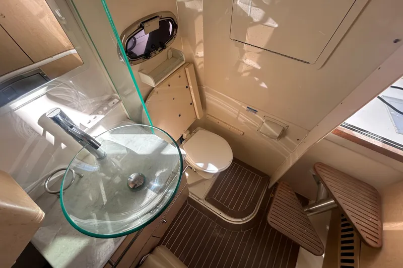 Slide: The Image of Interior of 2012 Boston Whaler 370 Outrage with bathroom. - 7