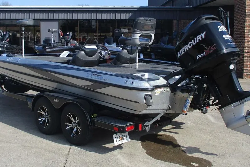 Slide: The Image of 2011 Triton 21XS Elite boat with Mercury Pro XS engine on trailer. - 3