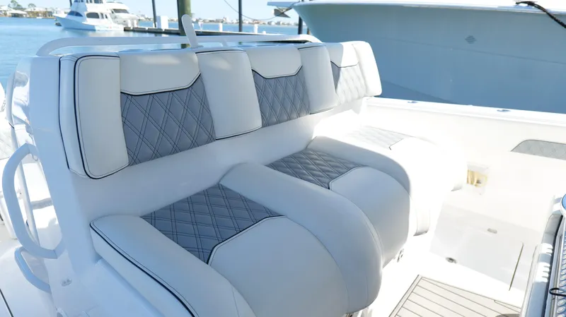 Slide: The Image of Luxury seating on 2020 Invincible 37 Catamaran, featuring diamond-stitched upholstery. - 17