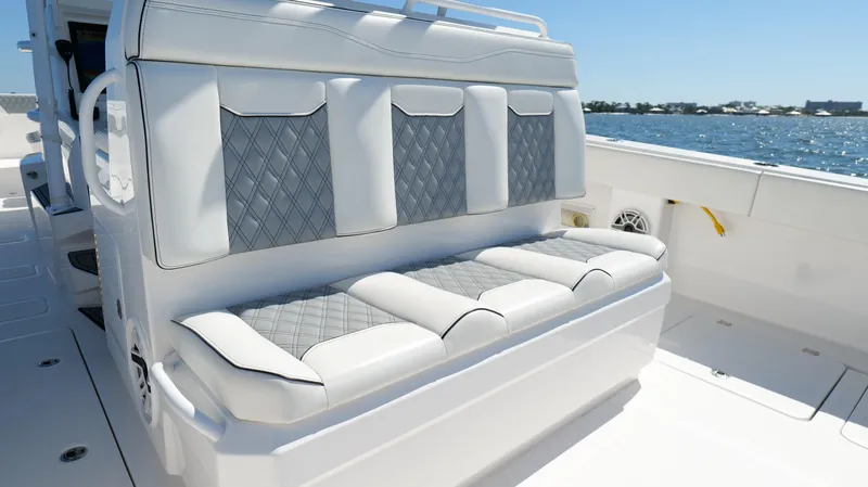 Slide: The Image of Luxury seating on 2020 Invincible 37 Catamaran, featuring diamond-patterned upholstery. - 24