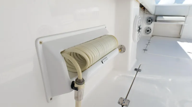 Slide: The Image of Invincible 37 Catamaran 2020 deck with coiled hose and speaker system. - 27