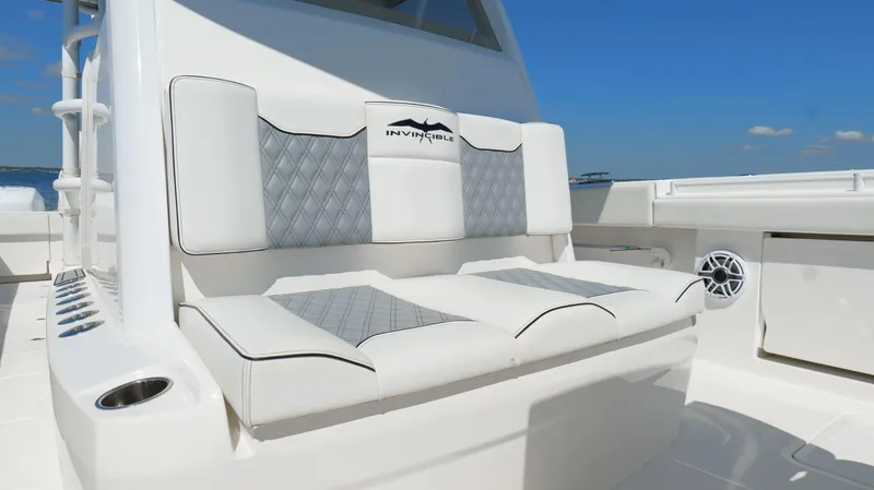 Slide: The Image of Invincible 37 Catamaran 2020, luxurious seating with diamond-patterned upholstery on deck. - 34