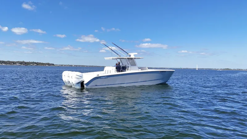 Slide: The Image of 2020 Invincible 37 Catamaran on open water under clear blue sky. - 5