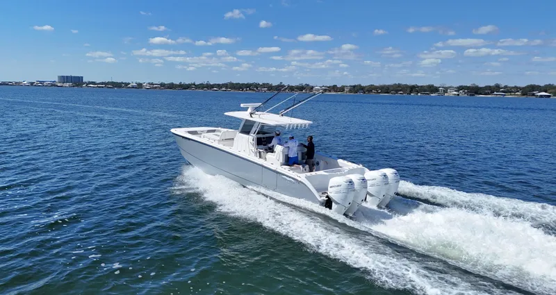 Slide: The Image of 2020 Invincible 37 Catamaran cruising on open water under clear skies. - 7