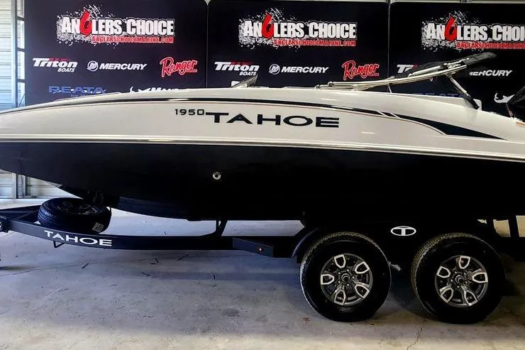 Slide: The Image of 2026 Tahoe 1950 boat on trailer at Anglers Choice showroom. - 0