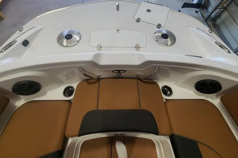 Slide: The Image of 2026 Tahoe 1950 boat interior with brown seating and modern design elements. - 10