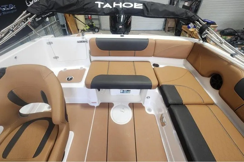 Slide: The Image of 2026 Tahoe 1950 boat interior with tan and black seating, showcasing modern design. - 12