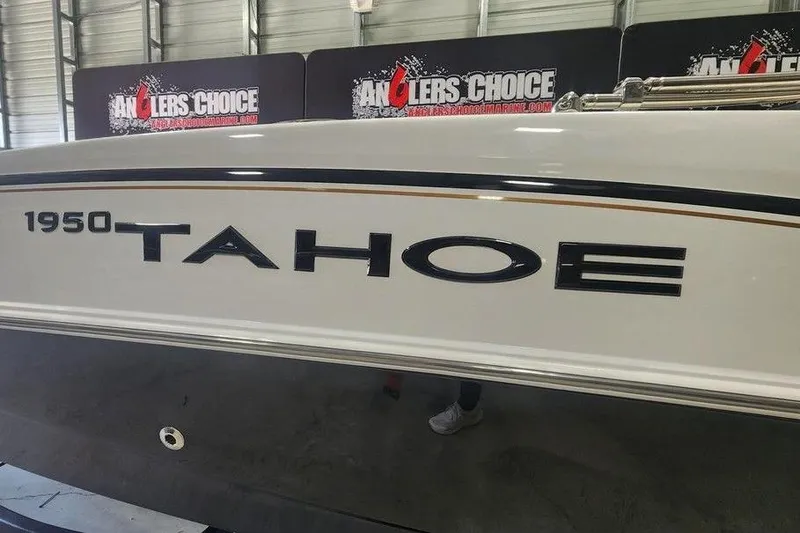 Slide: The Image of 2026 Tahoe 1950 boat displayed at Angler's Choice showroom. - 13