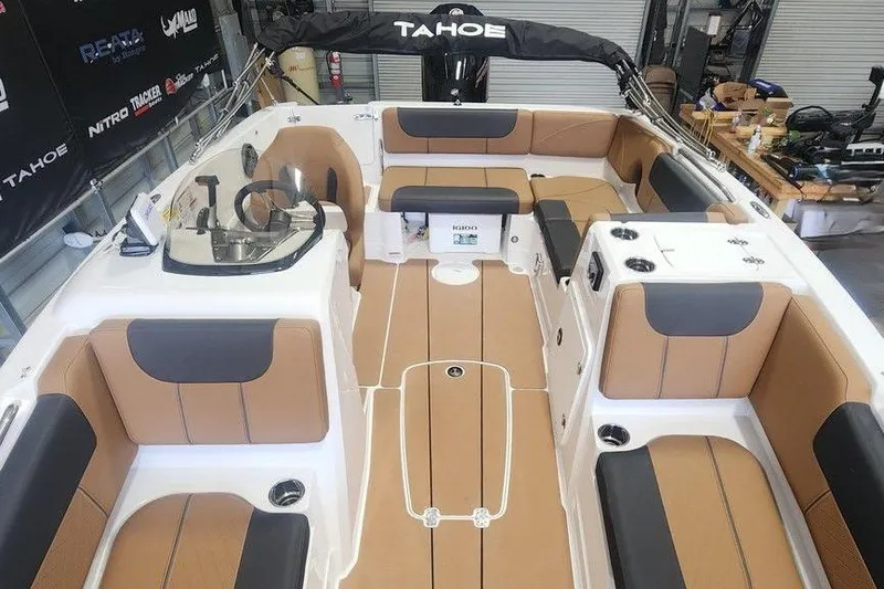 Slide: The Image of 2026 Tahoe 1950 boat interior with tan and black seating, spacious layout, and modern design. - 8