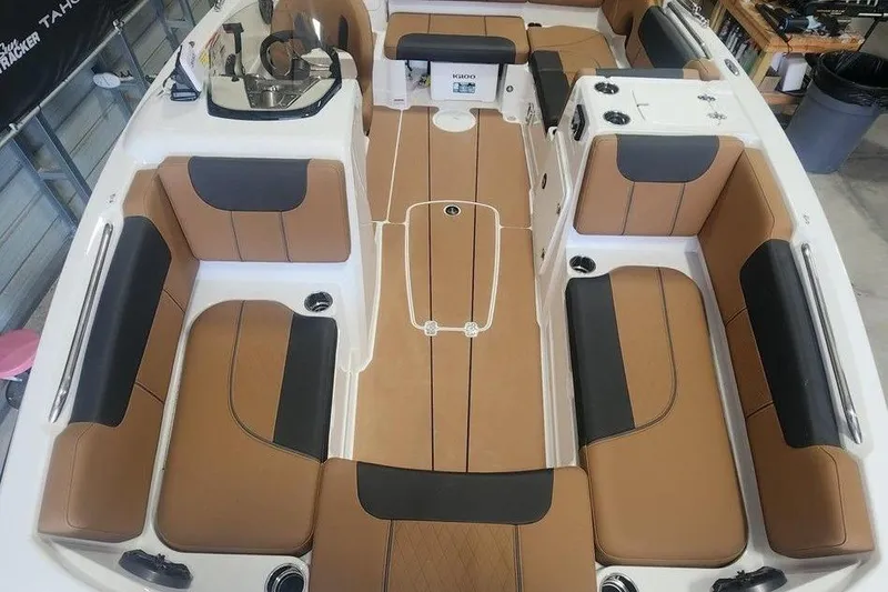 Slide: The Image of 2026 Tahoe 1950 boat interior with tan and black seating, spacious layout. - 9
