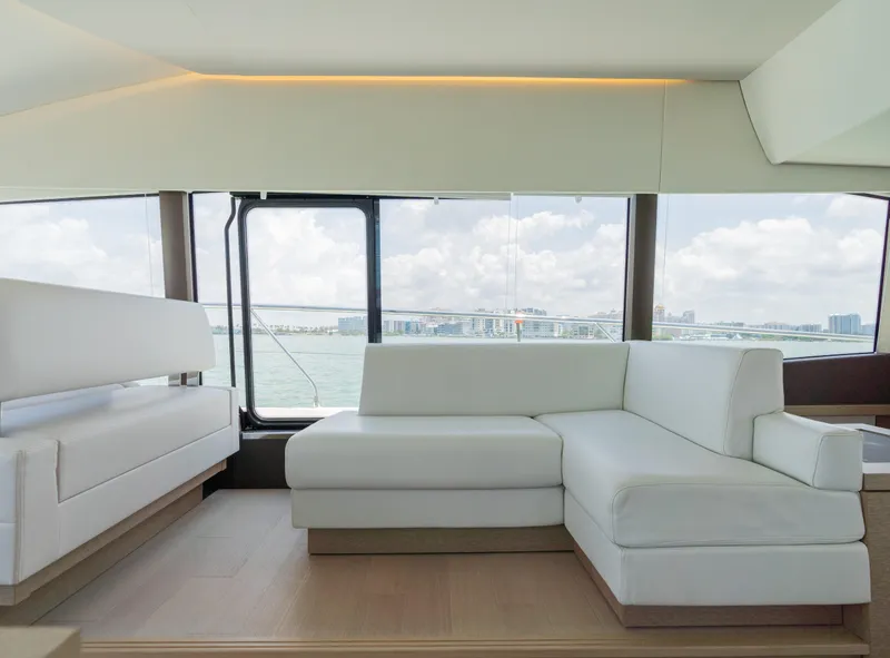 Slide: The Image of Luxurious interior of 2019 Prestige 520 Flybridge yacht with white leather seating. - 16