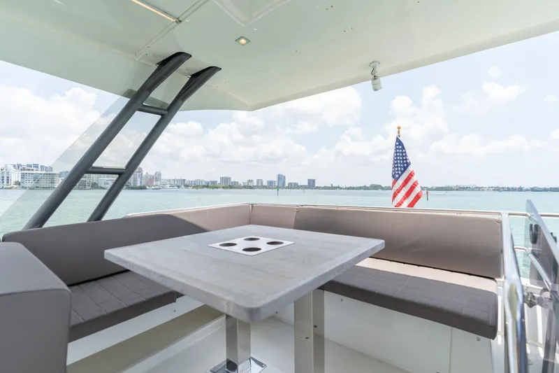 Slide: The Image of Prestige 520 Flybridge 2019 yacht with outdoor seating and ocean view. - 34