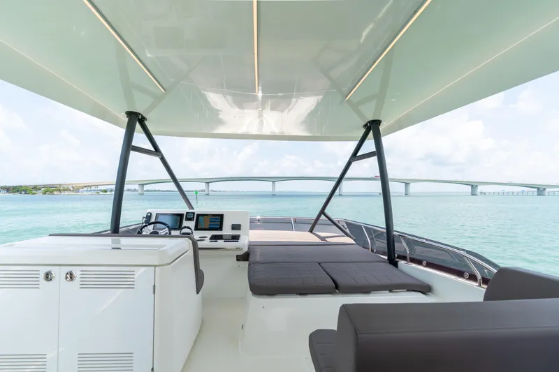 Slide: The Image of Prestige 520 Flybridge 2019 yacht interior with ocean view and bridge in the background. - 36