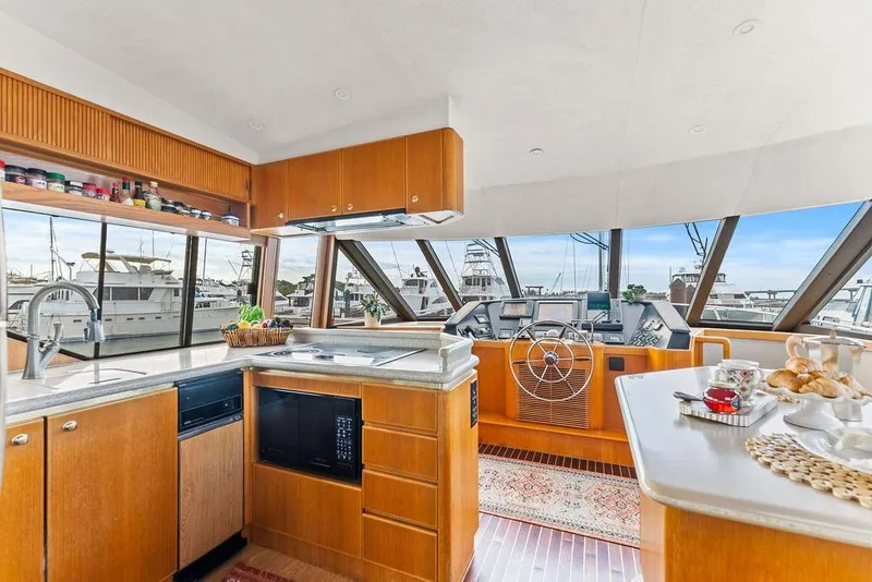 Slide: The Image of Luxurious 2000 West Bay 58 Sonship yacht interior with modern kitchen and helm. - 10